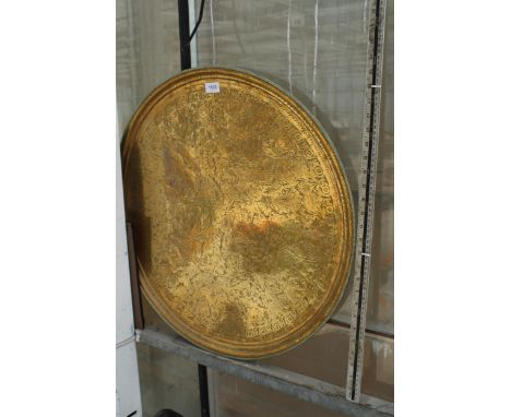 A LARGE VINTAGE BRASS CHARGER DEPICTING AN ORIENTAL SCENE 