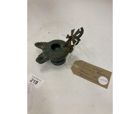 A POSSIBLE BRONZE, ROMAN OR BYZANTINE, OIL LAMP 