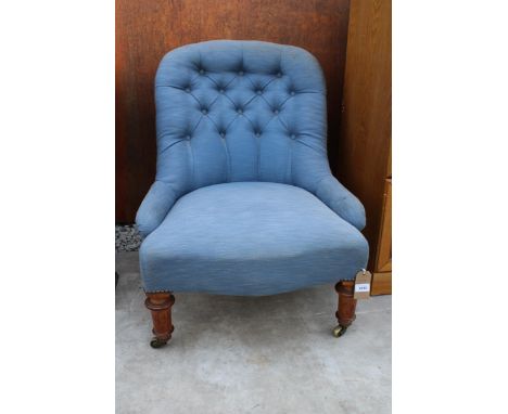 A VICTORIAN BUTTON-BACK NURSING CHAIR IN SMOKEY BLUE UPHOLSTERY STAMPED 'GILLOW' 