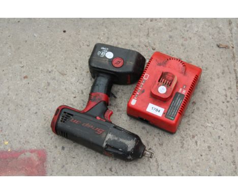 A SNAP ON IMPACT WRENCH WITH BATTERY AND CHARGER 