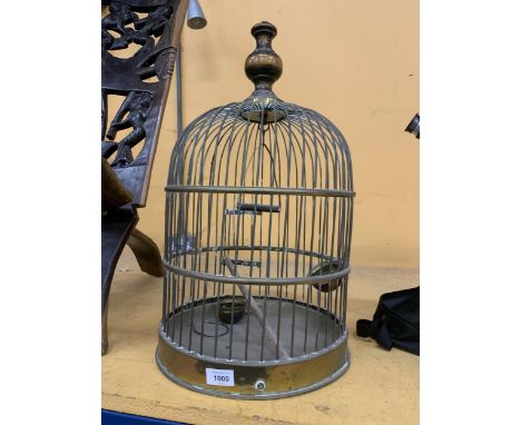 A VINTAGE BRASS BIRD CAGE WITH WOODEN FINIAL HEIGHT APPROX 56CM 