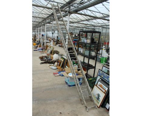 AN ALUMINIUM TWO SECTION 34 RUNG EXTENDING LADDER 