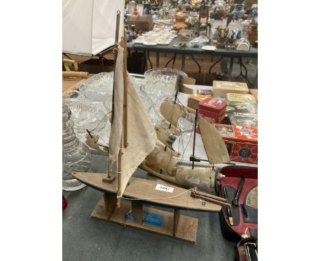 TWO VINTAGE MODELS OF BOATS TO INCLUDE A HORN SAILING SHIP AND A WOODEN YACHT 
