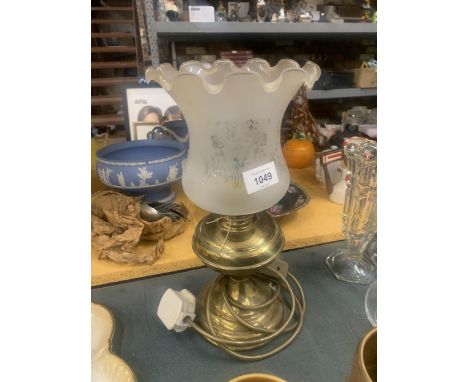 A CONVERTED TO ELECTRICITY, TILLY/HURRICANE TABLE LAMP.  VENDOR STATES IN WORKING ORDER, NO WARRANTY GIVEN 
