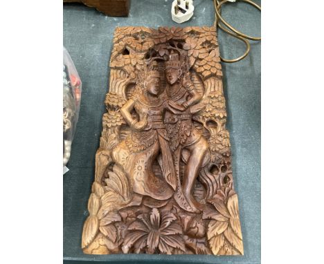 A WOODEN INDONESIA PANEL CARVING OF RAMA AND SITA 