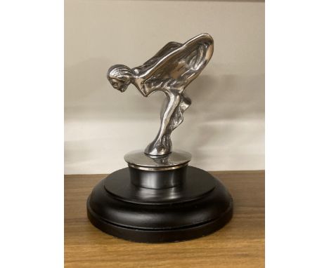 A CHROME MODEL OF A FLYING LADY ON A BASE 