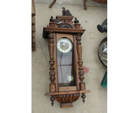 A MAHOGANY CASED CHIMING WALL CLOCK WITH EAGLE FINIAL (A/F) 