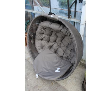 A SWINGING CHAIR WITH WALL MOUNTING BRACKET 