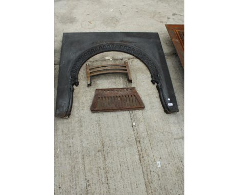 A DECORATIVE CAST IRON FIRE SURROUND WITH A FIRE FRONT AND GRATE BOTTOM 