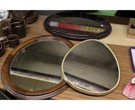 THREE VINTAGE MIRRORS TO INCLUDE A VINTAGE OVAL SEVENTIES RETRO MIRROR PLUS TWO FURTHER OVAL TREEN FRAMED MIRRORS 