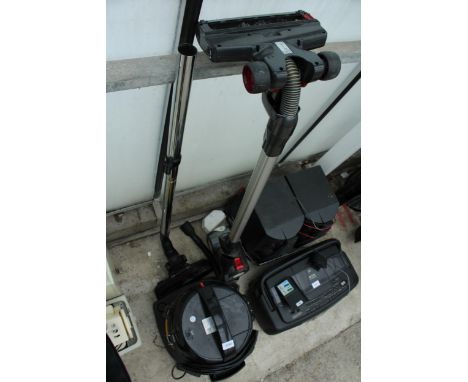 A TESCO VACUUM CLEANER AND A HOOVER STICK VACUUM 