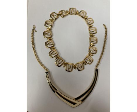 TWO YELLOW METAL CHOKER STYLE NECKLACES, ONE MARKED MONET 
