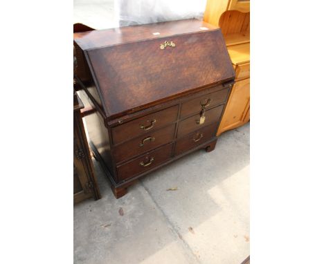 A GEORGE III MAHOGANY BUREAU WITH FITTED INTERIOR AND SIX DRAWERS TO BASE ON BRACKET FEET, 38" WIDE 