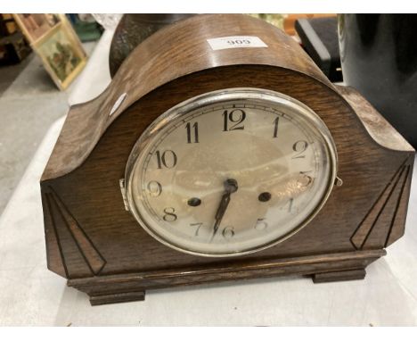 A VINTAGE OAK FRAMED GERMAN 'HALLER' CHIMING MANTLE CLOCK WITH KEY AND PENDULUM 
