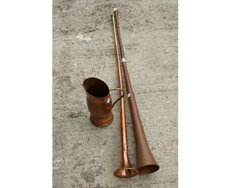 TWO VINTAGE BRASS AND COPPER COACHING HORNS AND A COPPER JUG 