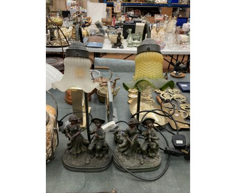 TWO FIGURAL LAMPS DEPICTING A BOY AND GIRL PLAYING INSTRUMENTS WITH TIFFANY STYLE SHADES 