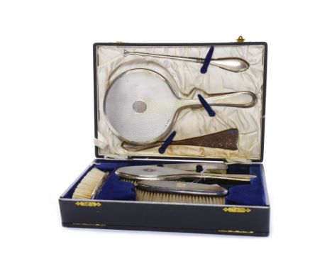 SILVER VANITY SET IN FITTED CASEmaker Deakin & Francis Ltd, Birmingham, 1926-27 and 1946-47, comprising hand mirror, button h