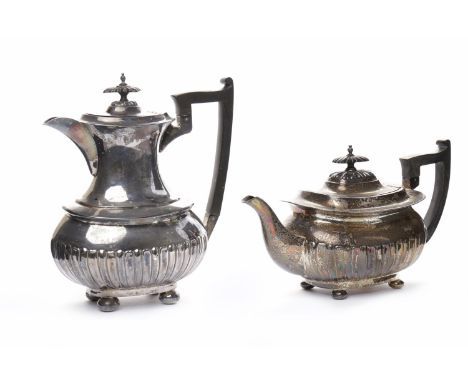 EDWARDIAN SILVER TEAPOT maker Walker & Hall, Sheffield 1909, with partially gadrooned body and ebonised handle and finial, ap