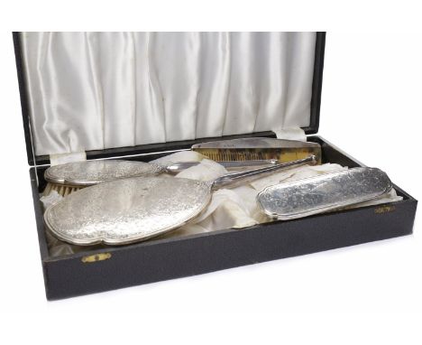SILVER MOUNTED VANITY SET maker Charles S Green & Co Ltd, Birmingham 1941/1952/1954/1964, comprising a handheld mirror, hairb