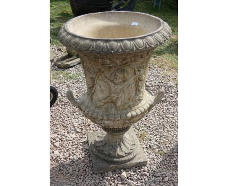 Large stone urn depicting Putti marked HGC - Height: 107cm
