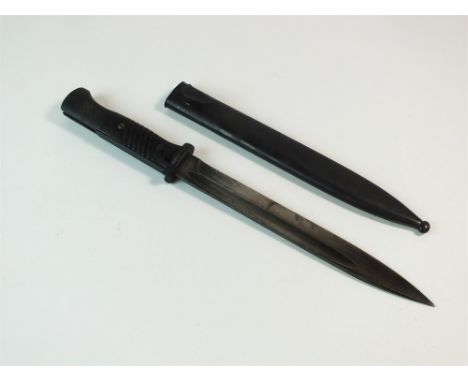 A World War II German S84/98 bayonet and scabbard, the blade marked 42 Cue and serial number 4812, blade length 25cm, overall