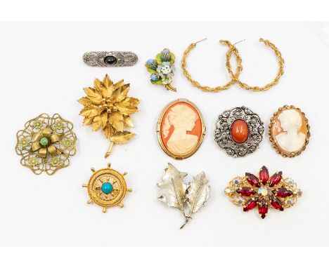 A collection of vintage costume jewellery to include paste set brooches, plated cameo brooch along with an enamel brooch etc 