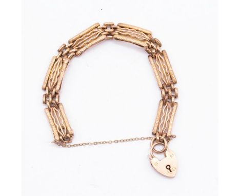 A 9ct gold gate bracelet with padlock clasp, comprising textured links,  length approx 15cm, weight approx 12gms Further deta