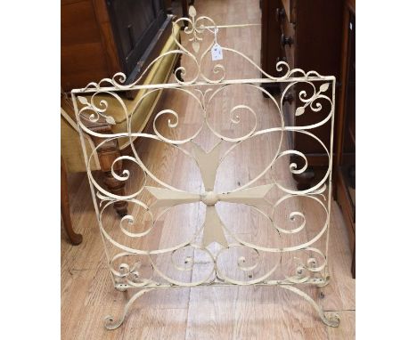 A 20th Century painted iron Maltese Cross fireguard, cream coloured, with carrying handle&nbsp;