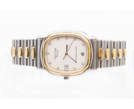 A two tone gents Girard Perregaux quartz chronometer wristwatch, comprising a signed cushion shaped silvered dial, stone set 