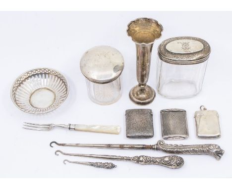 A collection of silver to include; two lidded vanity/toilet bottles, both hallmarked London, a London silver fluted rimmed sm