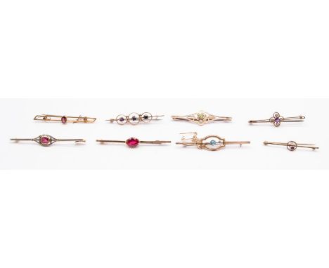 A collection of eight Edwardian gold and stone set brooches, to include an unmarked brooch set with tourmaline, platinum set,