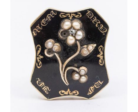 A 19century mourning brooch, comprising a rectangular form with canted corners of black enamel overlaid with wire work floral
