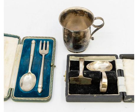 A collection of silver to include; A German 830 standard silver christening mug with stylised handle, maker FS, a cased silve