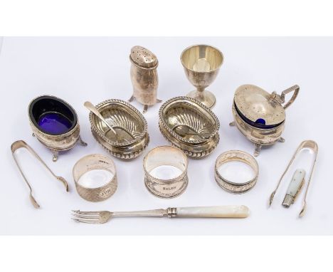 A collection of silver to include; a matching silver mustard pot and salt pot, both with blue glass liners, both hallmarked B