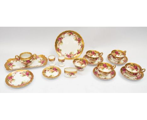 A collection of Golden Rose English bone china, including tea cups and saucers, dinner plates, sandwich platter, egg cups etc