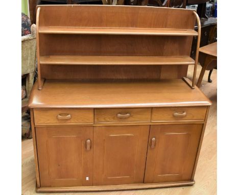 A mid-20th century Ercol style dining room set, i.e. drop leaf table badly damaged surface), four dining chairs, a Priory sid