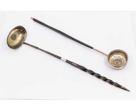 A Georgian white metal and twisted whale bone long toddy ladle, unmarked, with George II sixpence within bowl, approx. 38cm l