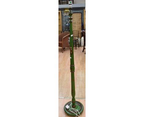 A mid-20th century Chinese-style standard lamp on a round base in a green colour with a Chinese design