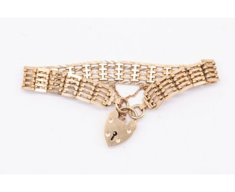 A 9ct gold gate bracelet with padlock clasp, width approx10mm, fold over clasp, length approx 18.5cm, weight approx 15.7gms F