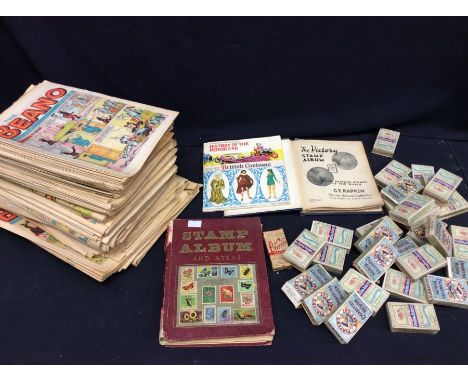 A collectors lot to include; 1970's Beano Comics and magazines; The Victory Stamp Album; a stamp album and atlas (both junior