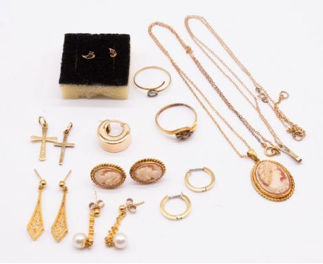 A collection of 9ct gold jewellery to include a cameo pendant and chain, cameo earrings, two crosses, diamond three stone rin