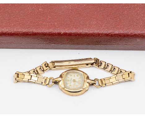 A ladies 9ct gold vintage Rotary wristwatch, textured dial with applied arrow and number markers, case approx 16mm, to a  wit