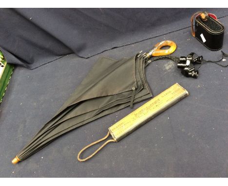 A Sterling silver 'snake skin' like mounted orange plastic handled parasol, with a Carbo Machine razor strop (USA) in box and