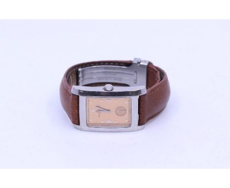 A Baume & Mercier gents wristwatch, comprising a steel rectangular case, bronzed dial with dot and number markers at 3, 6, 9,