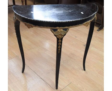 An early 20th century ebonised D-top hall mirror table with gilt detail to the wood