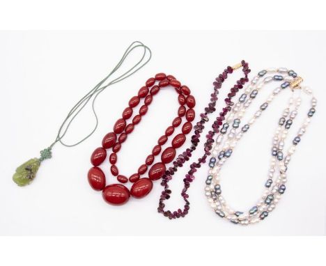 A collection of jewellery to include a cultured black, grey and white pearl three strand necklace with gold bead accents and 