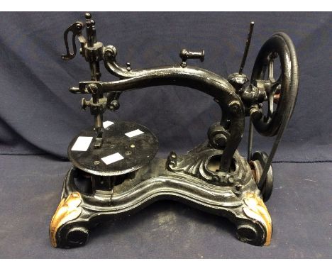 A small cast-iron table-top sewing machine, c.1860s