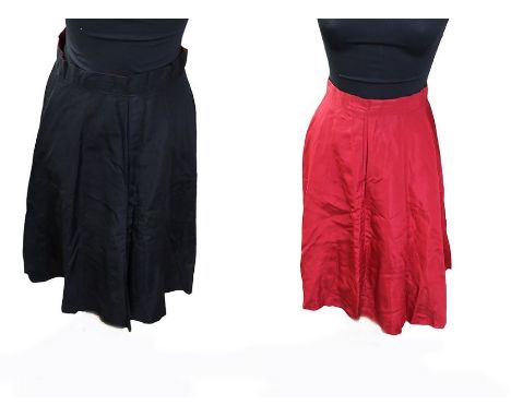 A late 1950s reversible (red taffeta/black) skater skirt, size 6/8, with a 4-button front fastening; a stiff white tulle/lace