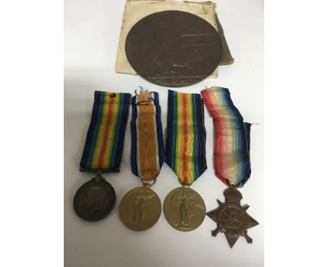 A pair of First World War medals and death plaque awarded to Harry gray p t e north N R and two other medals awarded to p j f