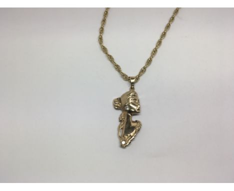 A ladies 9ct gold pendant of Art Nouveau design with attached 9ct gold chain, 16g approximately.
